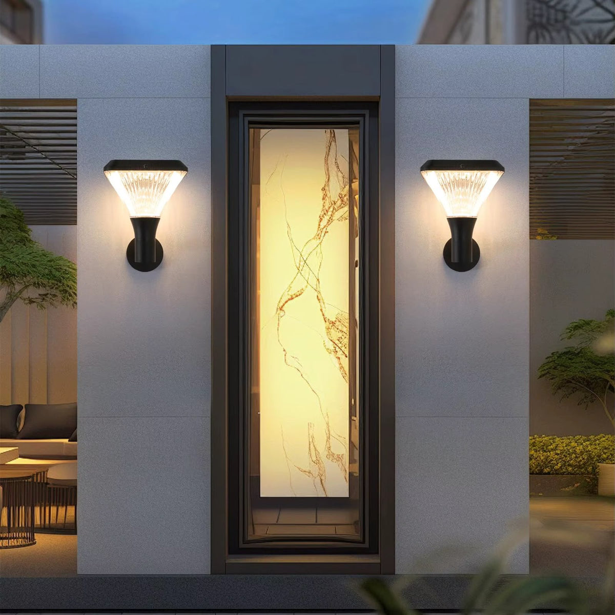 Two illuminated solar wall lights beside an entrance